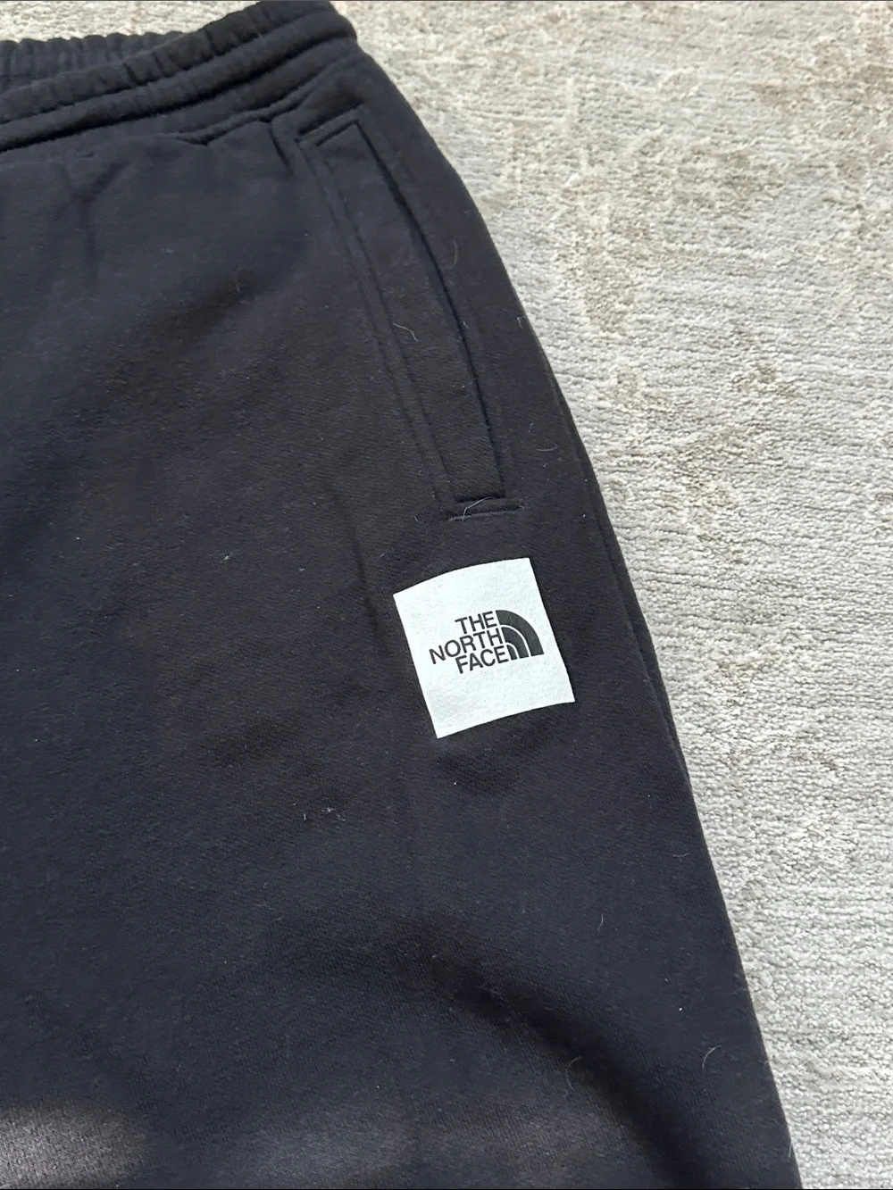 The North Face Men’s Large duo of one gray sweatpants and one black jogger.